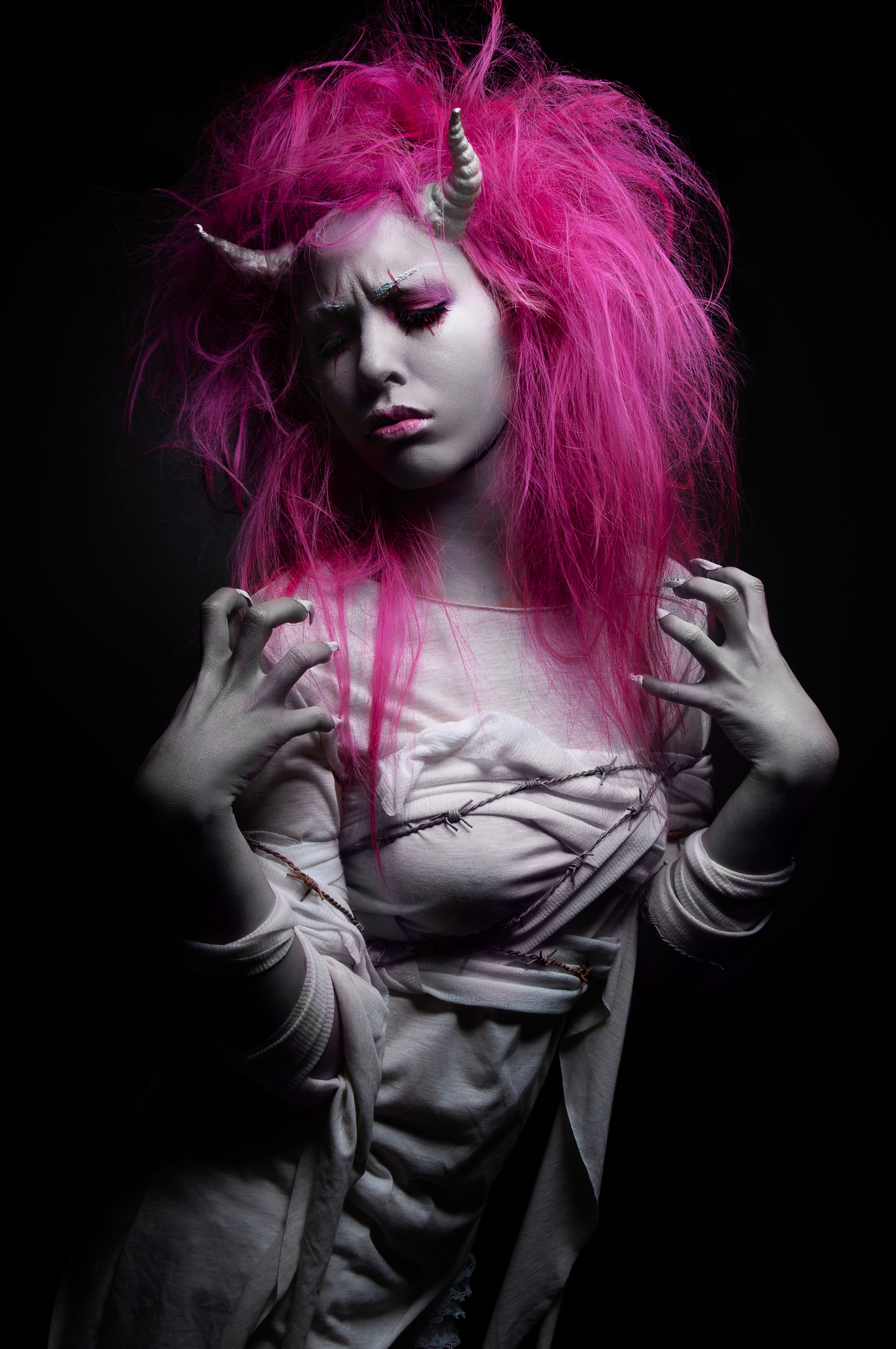 Horned fantasy portrait with vivid magenta hair